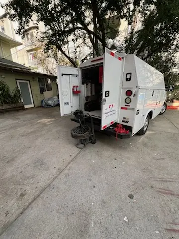 Magnet Plumbing service vehicle on-site for Grease Trap Cleaning in Jovita